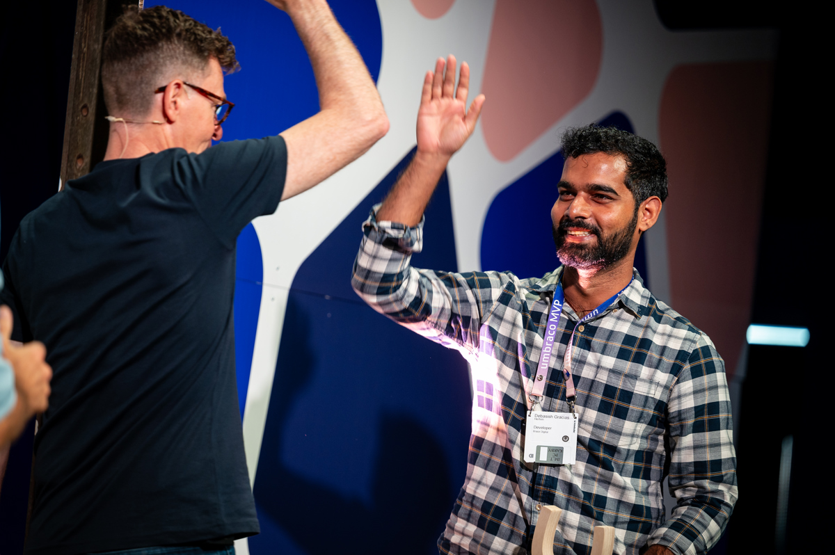 MVP getting high five on stage