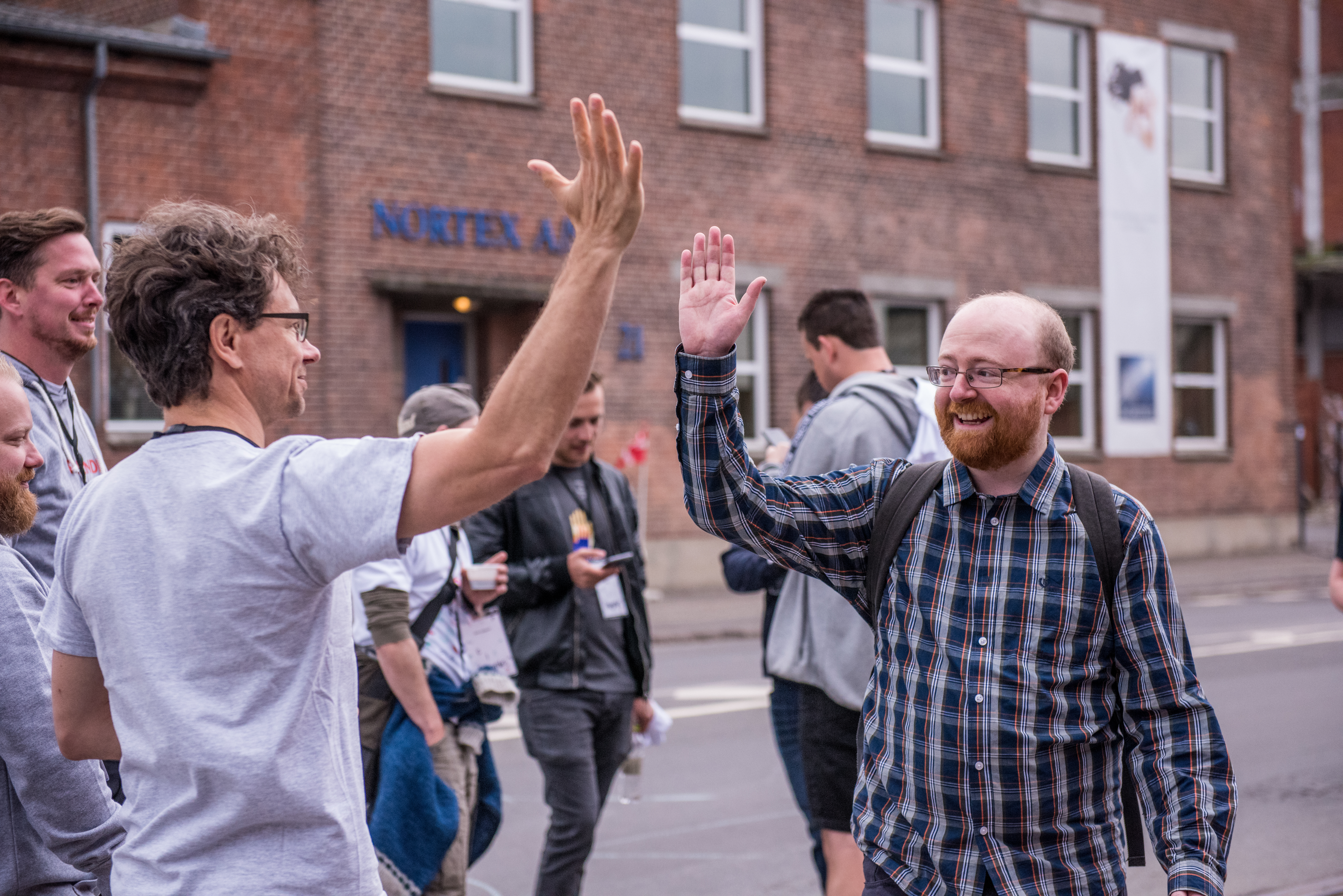 Two people high five'ing